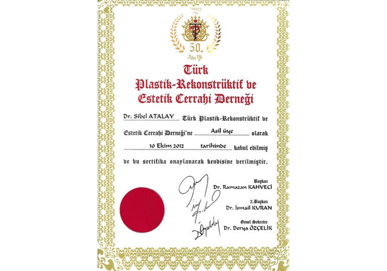 A formal certificate from the Turkish Society of Plastic, Reconstructive and Aesthetic Surgery, printed on white paper with a decorative gold border. The document features the organization's logo at the top center, formal typography in Turkish, and includes the name 'Dr. Sibel ATALAY' confirming her membership as of October 30, 2012. The certificate bears official signatures and a prominent red circular seal. The lighting is uniform and bright, typical of a scanned document, with no human subjects, anatomy, clothing, or make-up present.